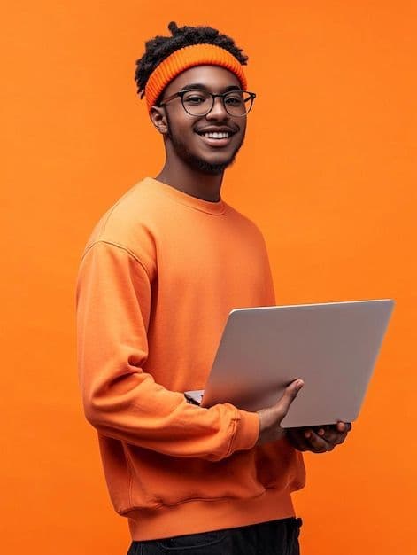 A Thrive EDU learner holding a laptop